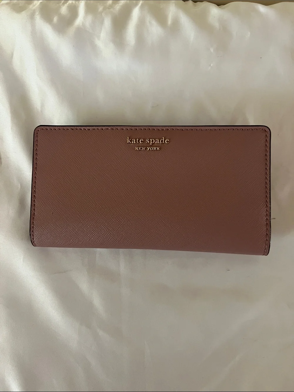 kate spade leather continental wallet in muted rose brown